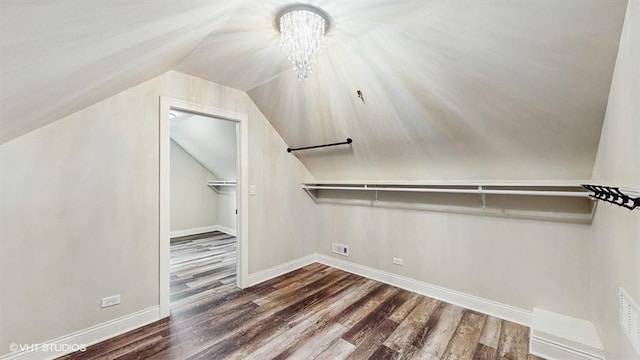 137 Forest Ave, Fox Lake, IL 60020 - walk in closet with wood finished floors, vaulted ceiling, and a chandelier