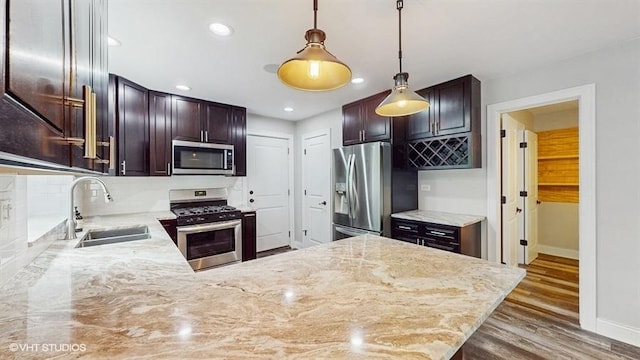 137 Forest Ave, Fox Lake, IL 60020 - kitchen featuring stainless steel appliances, wood finished floors, decorative light fixtures, dark brown cabinets, and recessed lighting