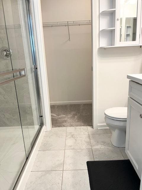 7031 Country Club Hills Dr, Fox Lake, IL 60020 - full bathroom featuring vanity, a spacious closet, a stall shower, and tile patterned floors