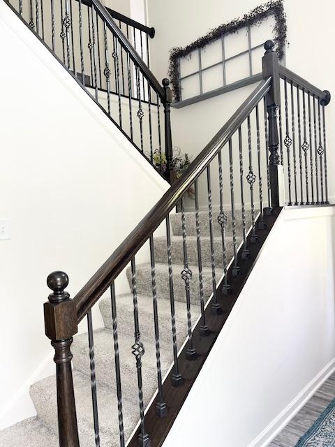 7031 Country Club Hills Dr, Fox Lake, IL 60020 - staircase featuring a high ceiling and wood finished floors