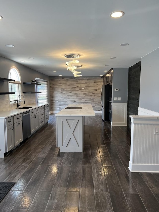2472 Worthington Dr, Aurora, IL 60506 - kitchen with stainless steel appliances, dark wood-style flooring, open shelves, light countertops, and a center island