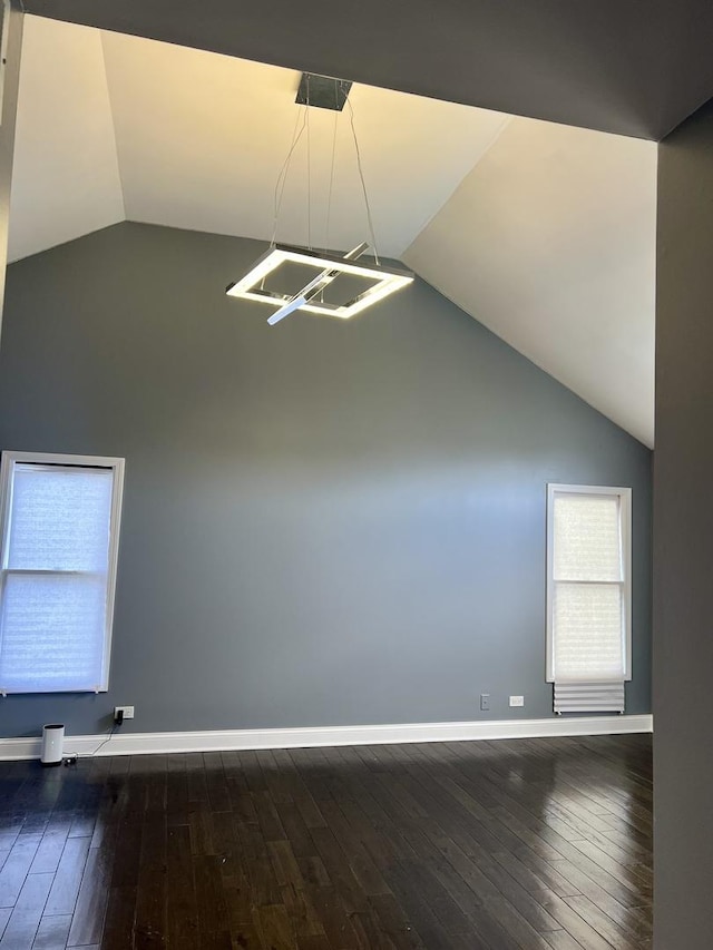 2472 Worthington Dr, Aurora, IL 60506 - spare room with lofted ceiling and dark wood-type flooring
