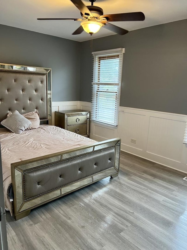 2472 Worthington Dr, Aurora, IL 60506 - bedroom featuring a wainscoted wall, wood finished floors, and ceiling fan