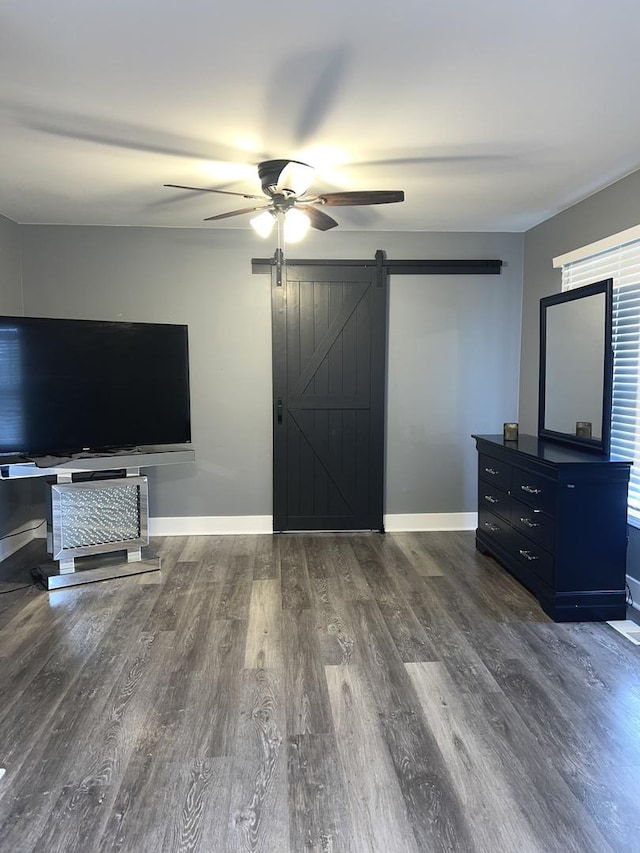 2472 Worthington Dr, Aurora, IL 60506 - unfurnished living room featuring a barn door, a ceiling fan, and wood finished floors