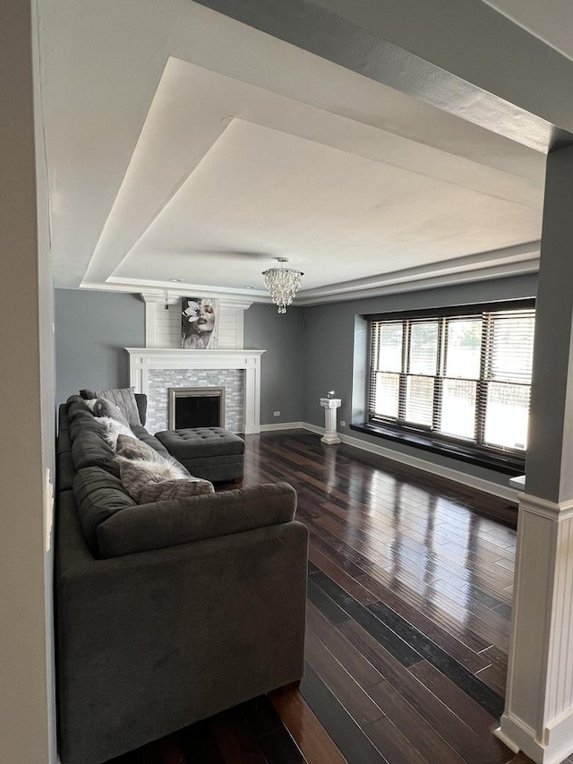 2472 Worthington Dr, Aurora, IL 60506 - living area featuring wood finished floors, a fireplace, and a chandelier
