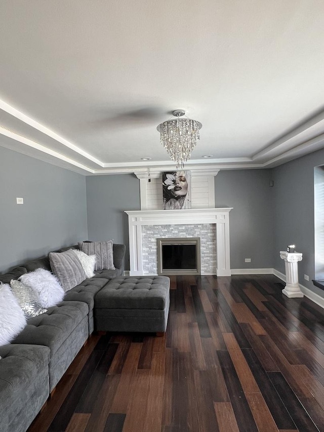 2472 Worthington Dr, Aurora, IL 60506 - living room with dark wood-type flooring, a chandelier, and a tiled fireplace