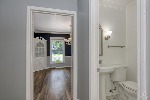 28426 W Lindbergh Dr, Barrington, IL 60010 - bathroom with crown molding, wood-type flooring, and a chandelier