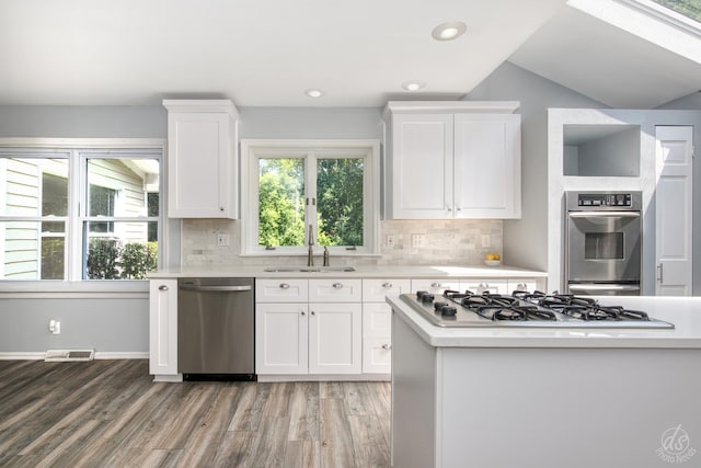28426 W Lindbergh Dr, Barrington, IL 60010 - kitchen with appliances with stainless steel finishes, light countertops, light wood-style flooring, white cabinets, and recessed lighting
