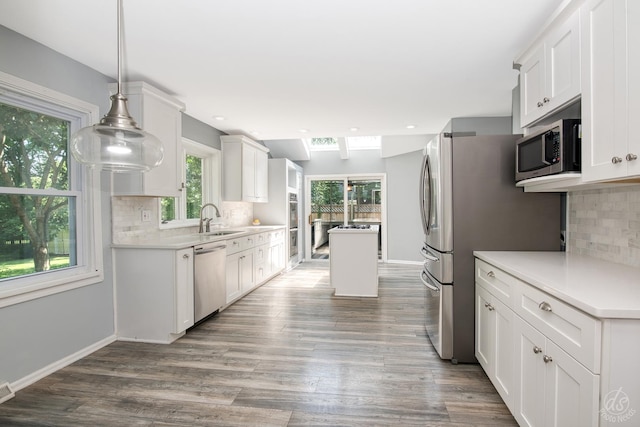 28426 W Lindbergh Dr, Barrington, IL 60010 - kitchen featuring stainless steel appliances, white cabinetry, wood finished floors, tasteful backsplash, and recessed lighting