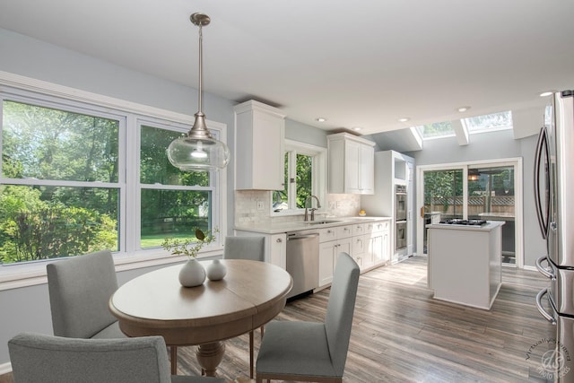 28426 W Lindbergh Dr, Barrington, IL 60010 - dining area featuring wood finished floors, a skylight, recessed lighting, and lofted ceiling