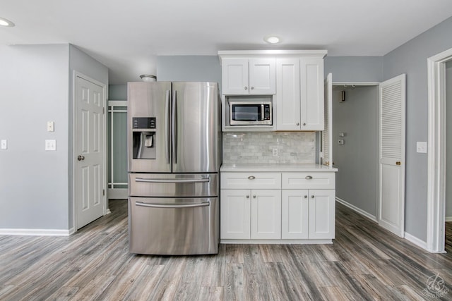 28426 W Lindbergh Dr, Barrington, IL 60010 - kitchen with appliances with stainless steel finishes, light wood-style floors, light countertops, white cabinets, and recessed lighting