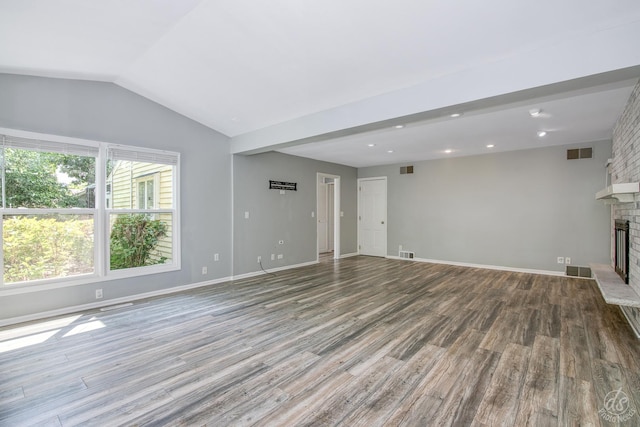 28426 W Lindbergh Dr, Barrington, IL 60010 - unfurnished living room with wood finished floors, vaulted ceiling, a brick fireplace, and recessed lighting