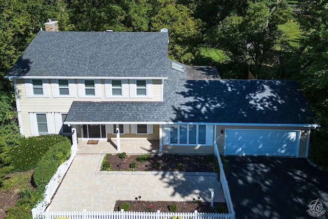 28426 W Lindbergh Dr, Barrington, IL 60010 - view of front facade featuring a fenced front yard, a chimney, roof with shingles, and a porch