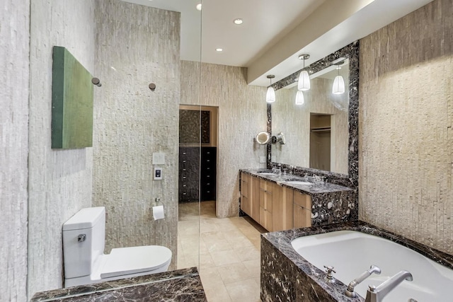 3822 N Claremont Ave, Chicago, IL 60618 - full bathroom with tile walls, a whirlpool tub, vanity, tile patterned flooring, and recessed lighting