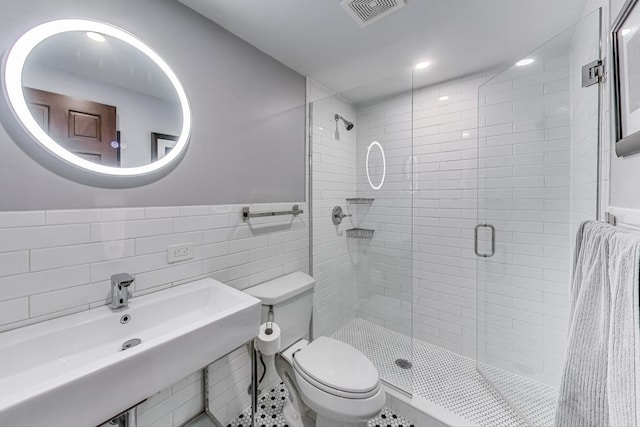 3822 N Claremont Ave, Chicago, IL 60618 - full bath with tile walls, a stall shower, a wainscoted wall, and recessed lighting