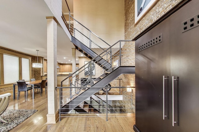 3822 N Claremont Ave, Chicago, IL 60618 - stairs featuring a towering ceiling and wood finished floors
