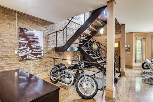 3822 N Claremont Ave, Chicago, IL 60618 - stairs featuring wood finished floors and brick wall