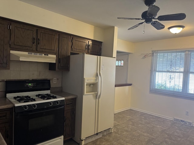 308 Old Indian Trl, Aurora, IL 60506 - kitchen with range with gas stovetop, under cabinet range hood, white fridge with ice dispenser, dark brown cabinets, and ceiling fan