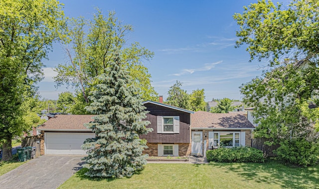 2025 Hermon Ave, Zion, IL 60099 - tri-level home with brick siding, driveway, and a garage