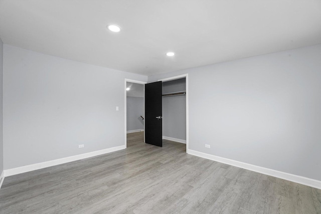 49 Stacy Ct, Glenview, IL 60025 - unfurnished bedroom featuring wood finished floors, a closet, and recessed lighting