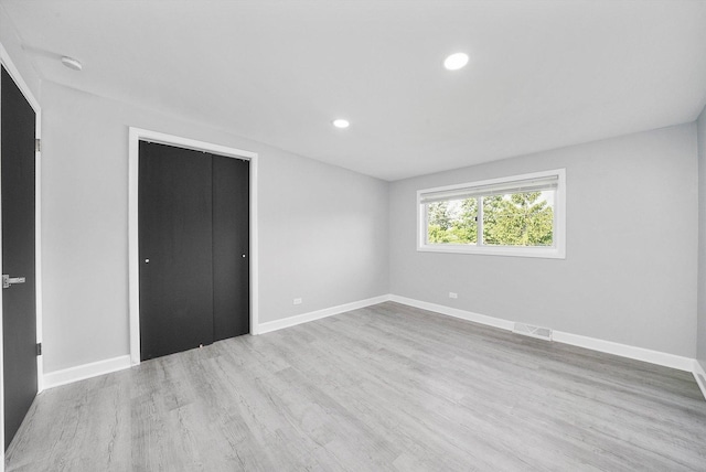 49 Stacy Ct, Glenview, IL 60025 - unfurnished bedroom featuring wood finished floors and recessed lighting