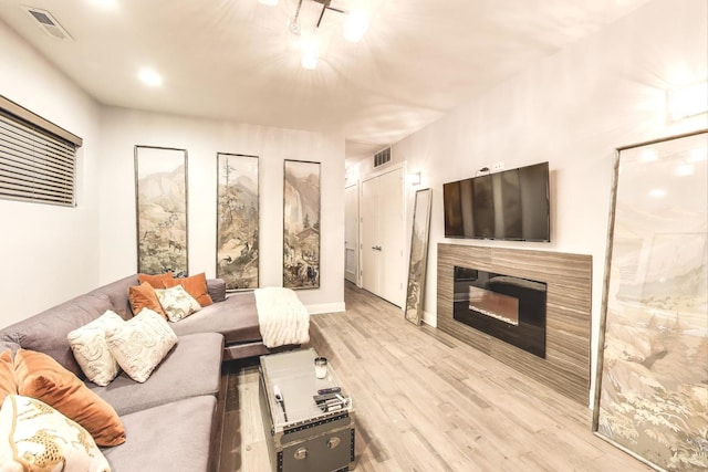 3743 N Kenmore Ave Unit 1, Chicago, IL 60613 - living area with wood finished floors and a glass covered fireplace