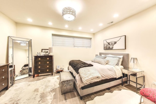 3743 N Kenmore Ave Unit 1, Chicago, IL 60613 - bedroom with wood finished floors and recessed lighting