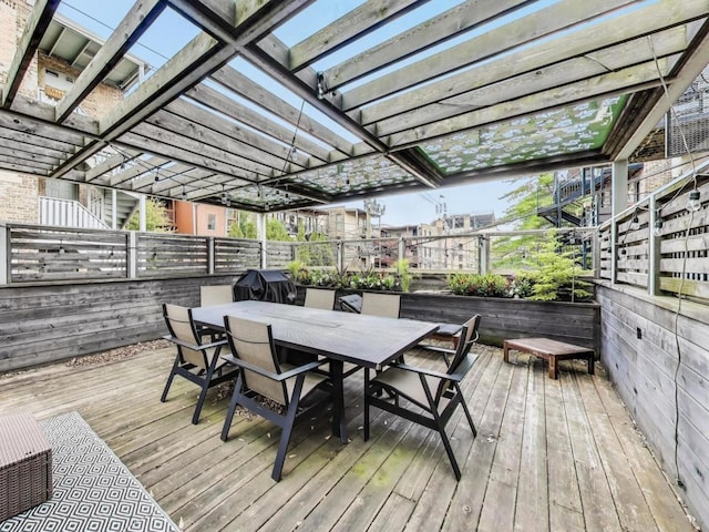 3743 N Kenmore Ave Unit 1, Chicago, IL 60613 - wooden terrace with outdoor dining space, area for grilling, and a pergola