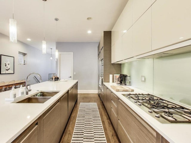 3743 N Kenmore Ave Unit 1, Chicago, IL 60613 - kitchen featuring stainless steel gas stovetop, dark wood-type flooring, modern cabinets, light countertops, and recessed lighting
