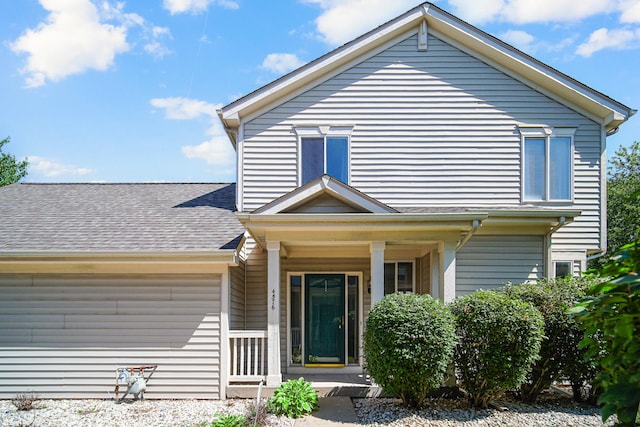 4576 Hilltop Dr, Loves Park, IL 61111 - view of front of home featuring a shingled roof and covered porch