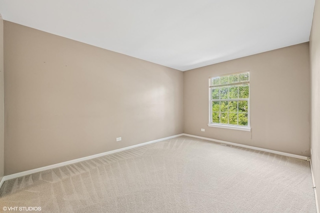 1234 Ballantrae Pl Unit D, Mundelein, IL 60060 - spare room with baseboards and carpet flooring