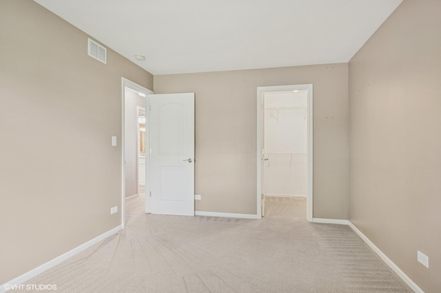 1234 Ballantrae Pl Unit D, Mundelein, IL 60060 - unfurnished bedroom with a spacious closet and carpet floors