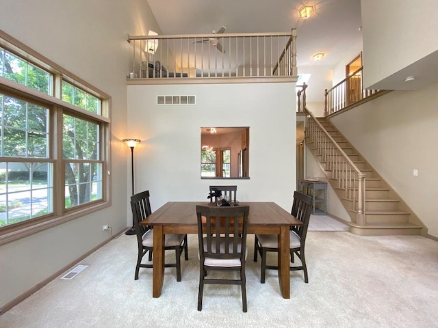 1920 Waverly Cir, Saint Charles, IL 60174 - carpeted dining area with stairway and a towering ceiling