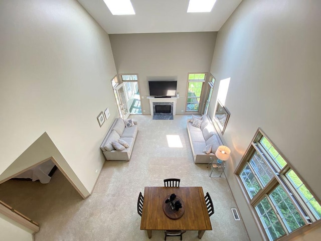 1920 Waverly Cir, Saint Charles, IL 60174 - living area featuring carpet floors, high vaulted ceiling, and a premium fireplace