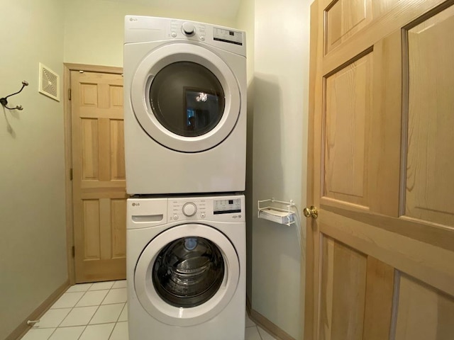 1920 Waverly Cir, Saint Charles, IL 60174 - laundry area featuring stacked washer / drying machine and light tile patterned floors