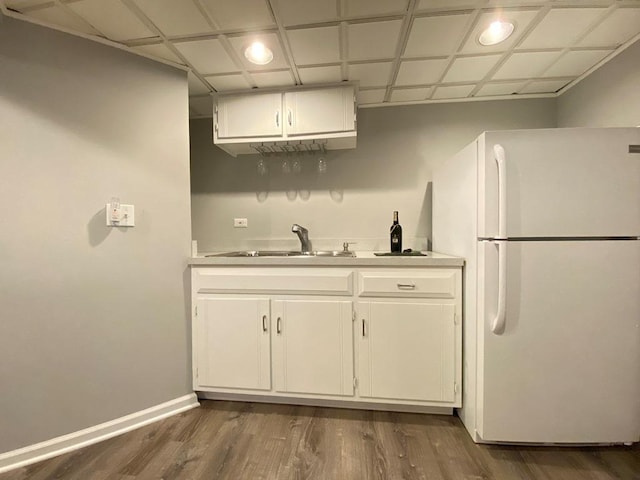 1920 Waverly Cir, Saint Charles, IL 60174 - kitchen with freestanding refrigerator, dark wood finished floors, light countertops, white cabinetry, and recessed lighting