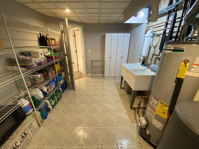 1920 Waverly Cir, Saint Charles, IL 60174 - below grade area with water heater, a paneled ceiling, and light floors
