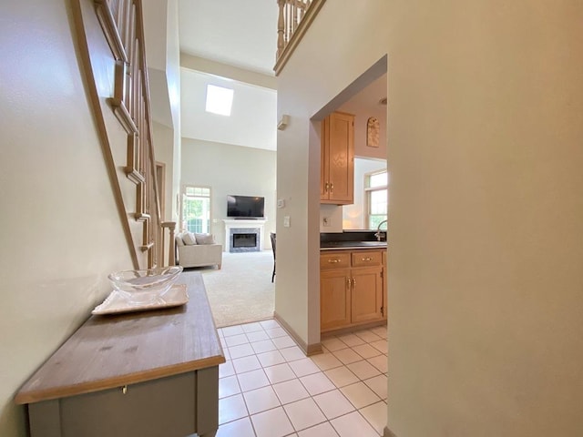 1920 Waverly Cir, Saint Charles, IL 60174 - hallway featuring light tile patterned floors, healthy amount of natural light, and light colored carpet