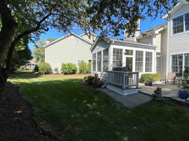 1920 Waverly Cir, Saint Charles, IL 60174 - view of green lawn featuring a sunroom and a patio area