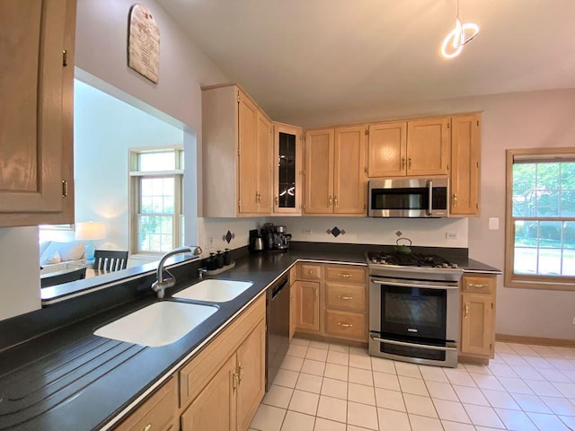 1920 Waverly Cir, Saint Charles, IL 60174 - kitchen with stainless steel appliances, dark countertops, light tile patterned floors, and light brown cabinets
