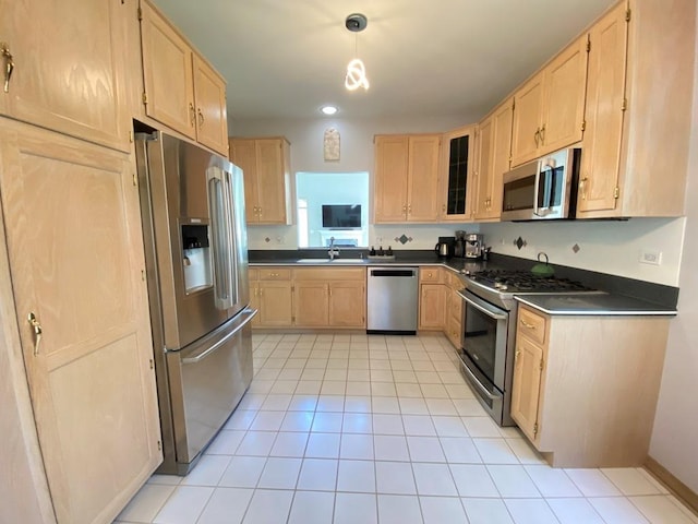 1920 Waverly Cir, Saint Charles, IL 60174 - kitchen featuring appliances with stainless steel finishes, light brown cabinets, dark countertops, light tile patterned floors, and recessed lighting