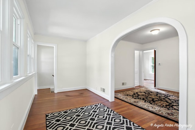 67 Wells St, Fox Lake, IL 60020 - foyer entrance with arched walkways, wood-type flooring, and ornamental molding