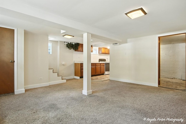 67 Wells St, Fox Lake, IL 60020 - below grade area featuring stairway and light colored carpet