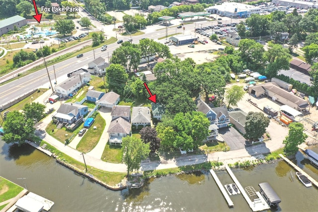 67 Wells St, Fox Lake, IL 60020 - aerial view of property and surrounding area featuring a nearby body of water and nearby suburban area