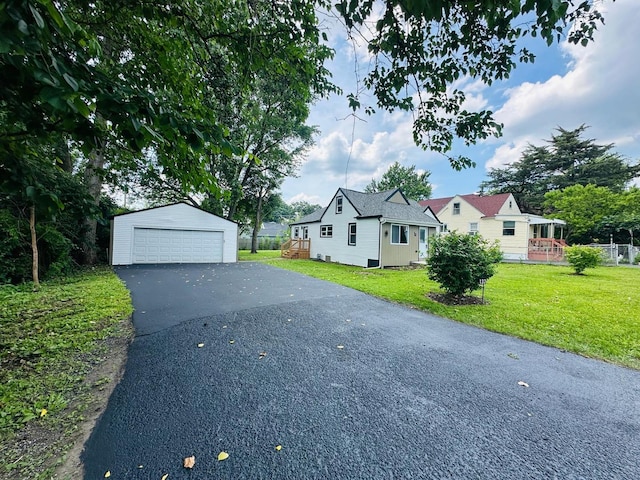 1326 N Poplar Ave, Round Lake Beach, IL 60073 - view of front of property with an outdoor structure, a garage, and a front lawn