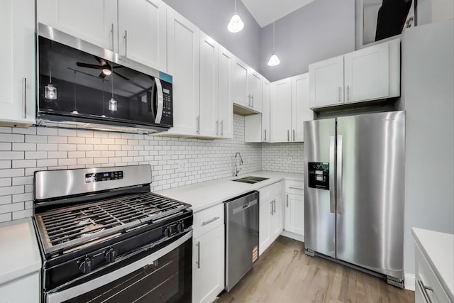 6415 S Kimbark Ave Unit 3, Chicago, IL 60637 - kitchen featuring appliances with stainless steel finishes, light countertops, and white cabinets