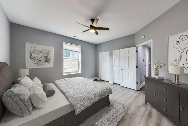6415 S Kimbark Ave Unit 3, Chicago, IL 60637 - bedroom featuring multiple closets, light wood-style floors, and ceiling fan