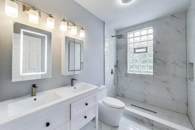 6415 S Kimbark Ave Unit 3, Chicago, IL 60637 - full bath with double vanity, a marble finish shower, and marble look tiles