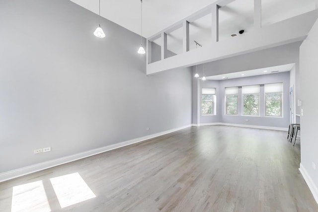 6415 S Kimbark Ave Unit 3, Chicago, IL 60637 - unfurnished living room with a towering ceiling and wood finished floors