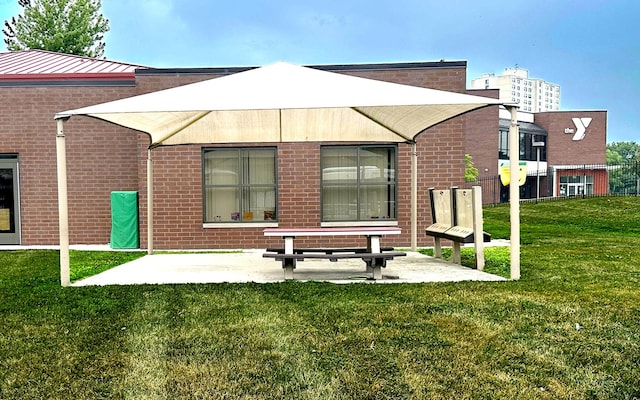 6415 S Kimbark Ave Unit 3, Chicago, IL 60637 - back of house featuring brick siding, a yard, and a patio